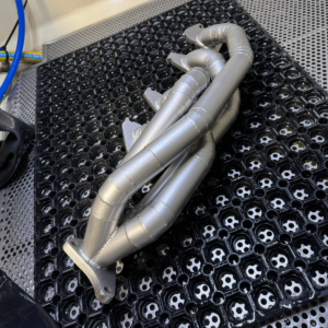 Uitlaatspruitstuk gereinigd